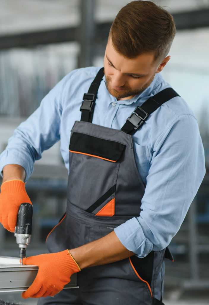 Manual worker assembling PVC windows and doors